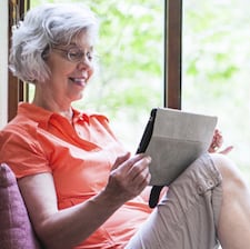 Woman Reading an iPad