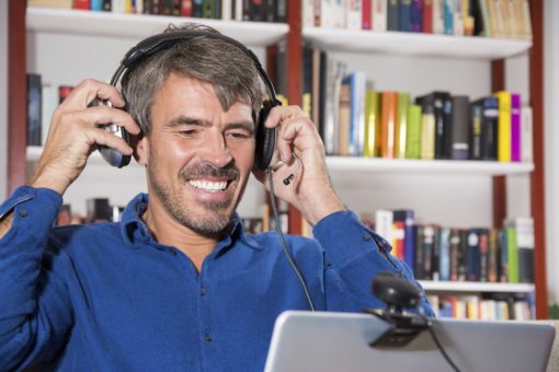 Man putting on headset for video session