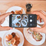 A picture of a person taking a picture of food