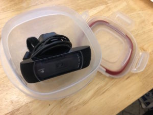 Roy's Logitech camera in some tupperware